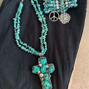 Woman’s cross and bracelet set jewelry